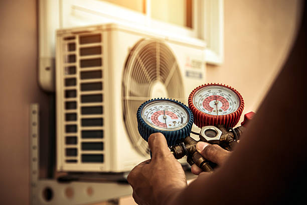 Professional Heat Pump Repair technician working in Fultondale, AL